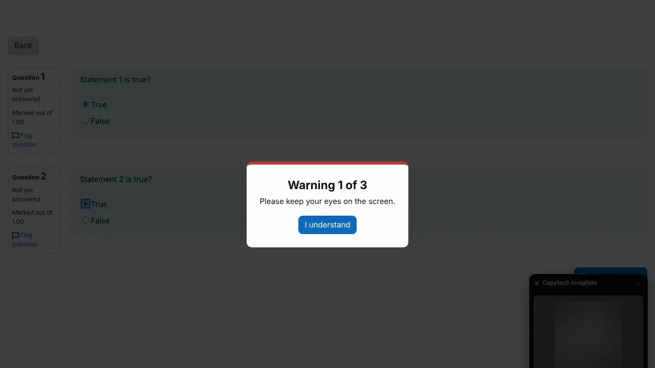 A student's exam with a warning on screen, Warning 1 of 3, please keep your eyes on the screen, and an I understand button